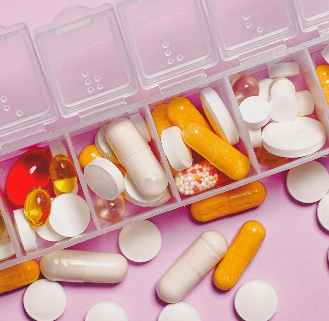 A close up of a medicine pack with various medications inside, representing a Home Medicines Review