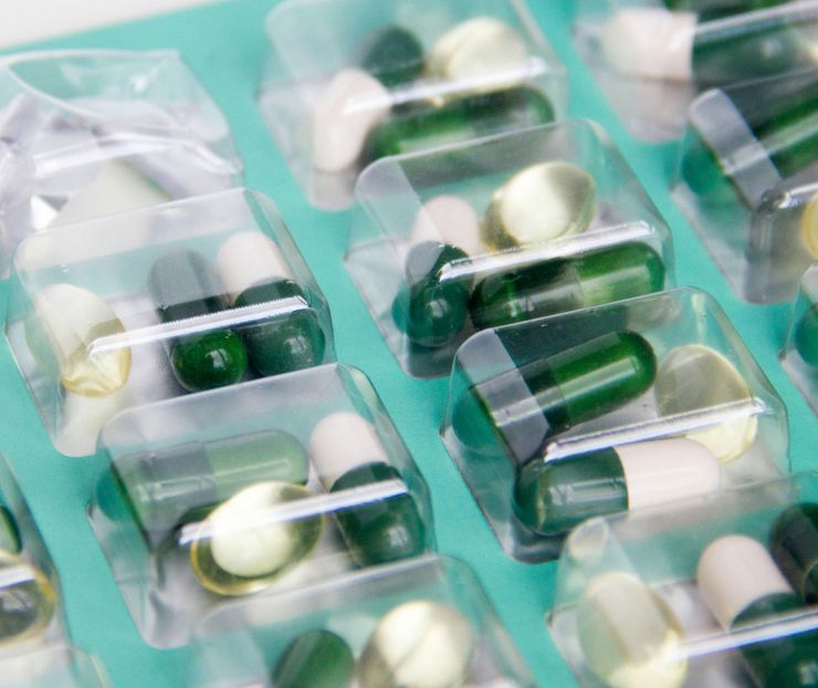A close-up of medicines pre-packed into a foil sealed packet